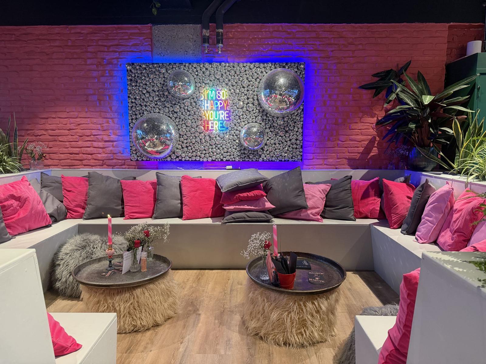 The drinks corner with cushioned bench and disco balls